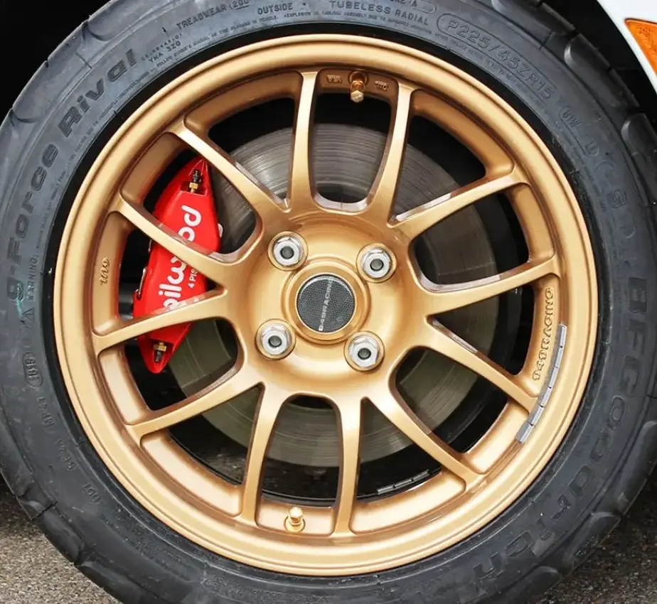 Brake systems with four-piston calipers