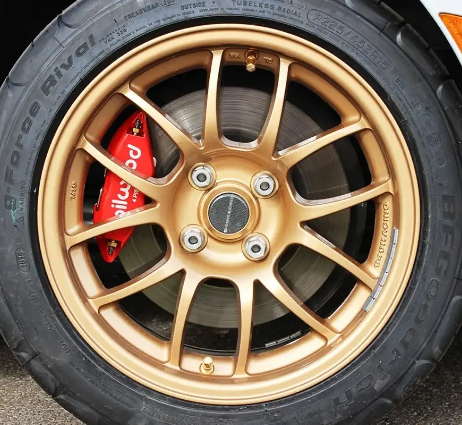 Brake systems with four-piston calipers