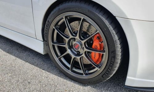 Brake systems with four-piston calipers